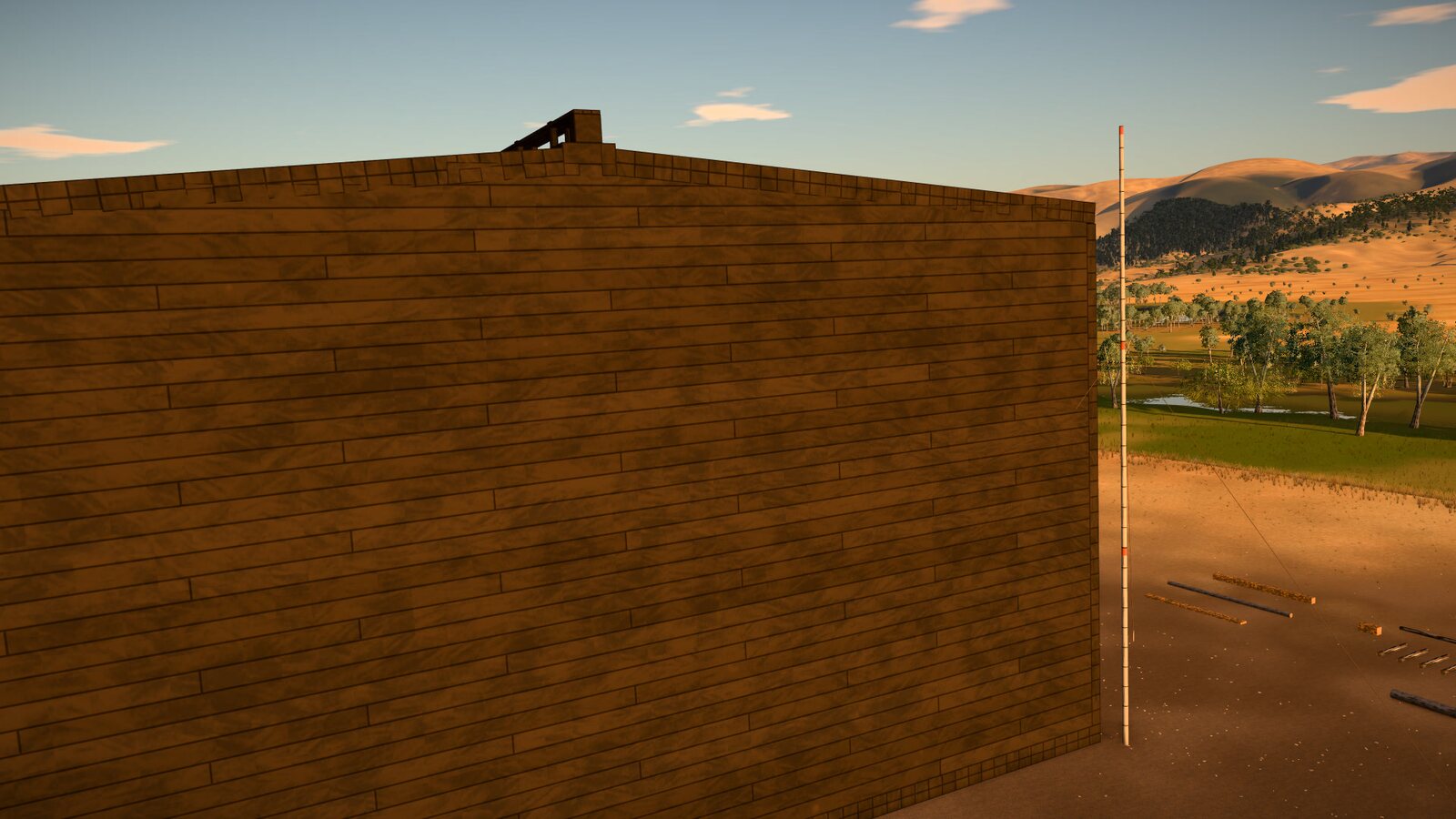 The end of the ark, a wall of horizontal planks; its top edge rises gently to a small raised cap at the middle. A tall marked pole stands at the corner, with the valley beyond.
